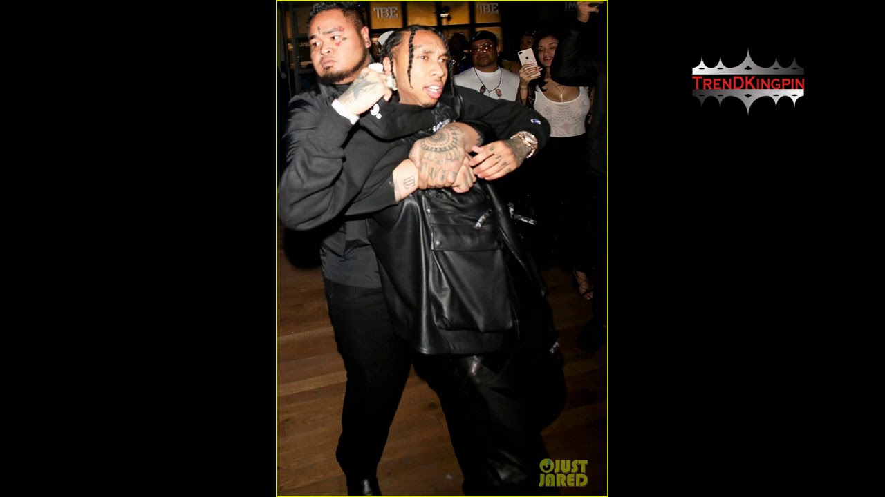 Tyga picks up a gun after being dragged out from Floyd Mayweather after party